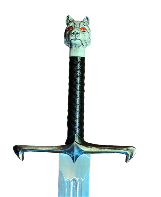 Decorative sword with a wolf head handle on a white background