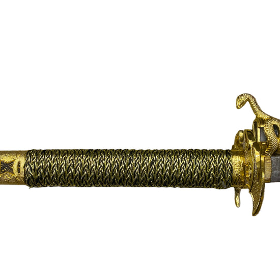 Decorative sword with gold handle and blade on a white background