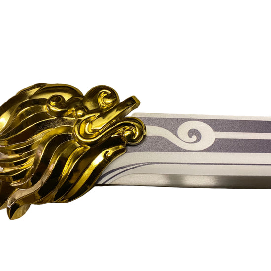 Decorative sword with gold dragon hilt on a white background