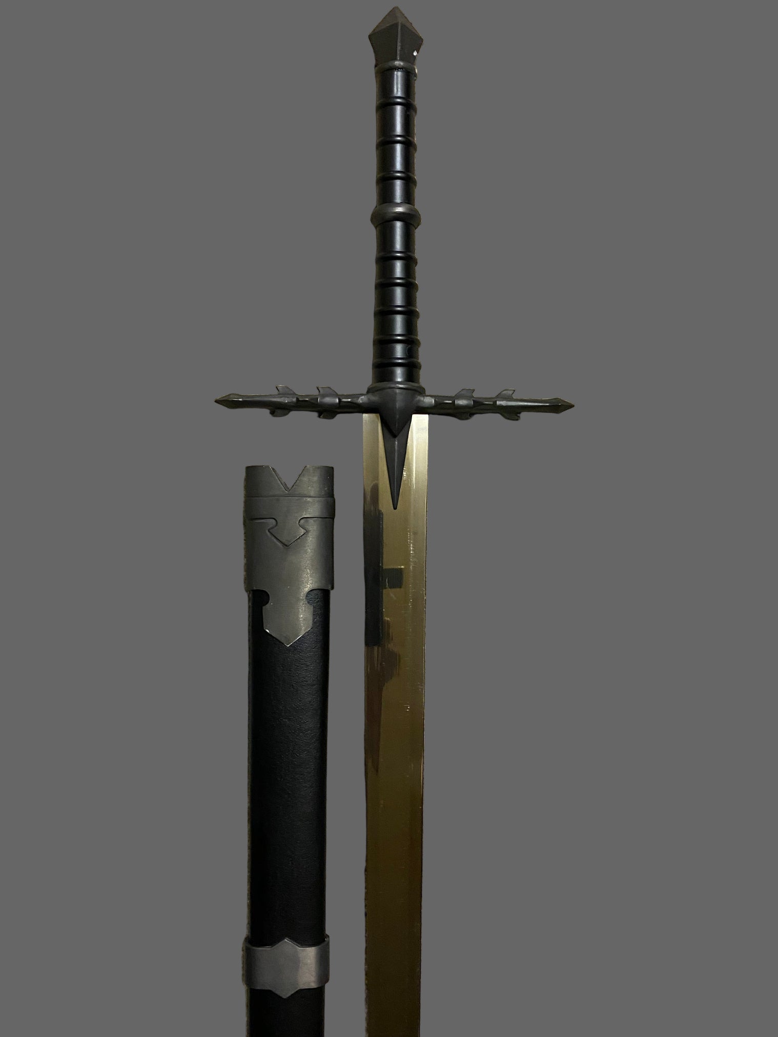 Sword with black handle and blade on grey background
