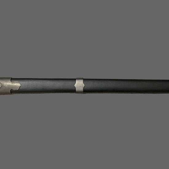 Sword with a black handle and silver blade on a gray background