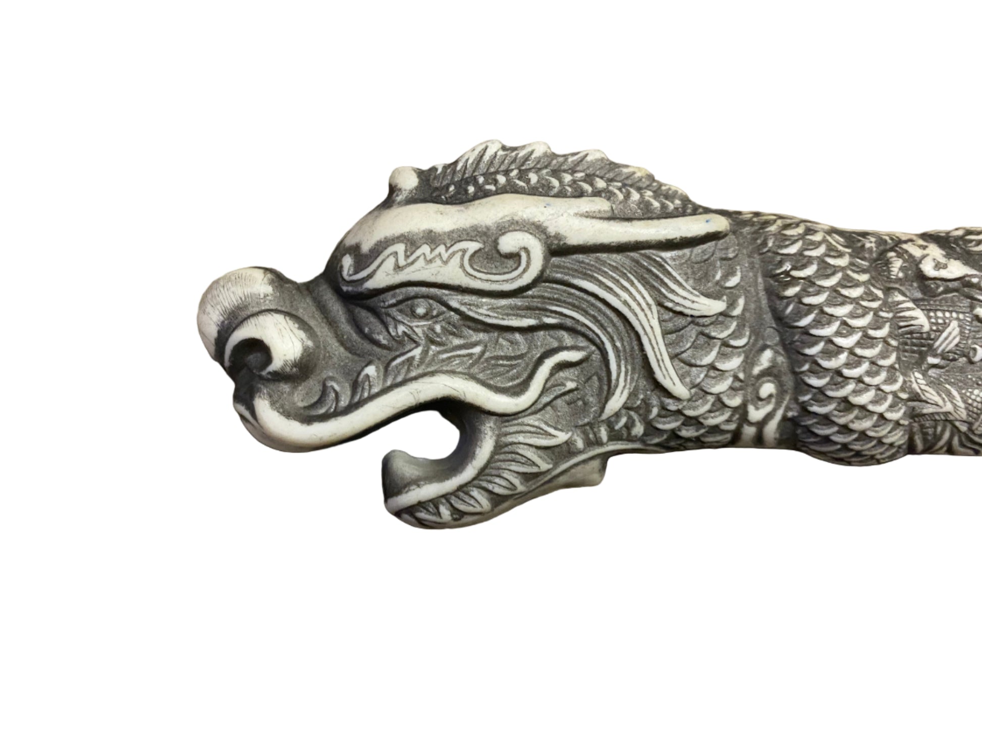 Decorative dragon head sculpture on a white background