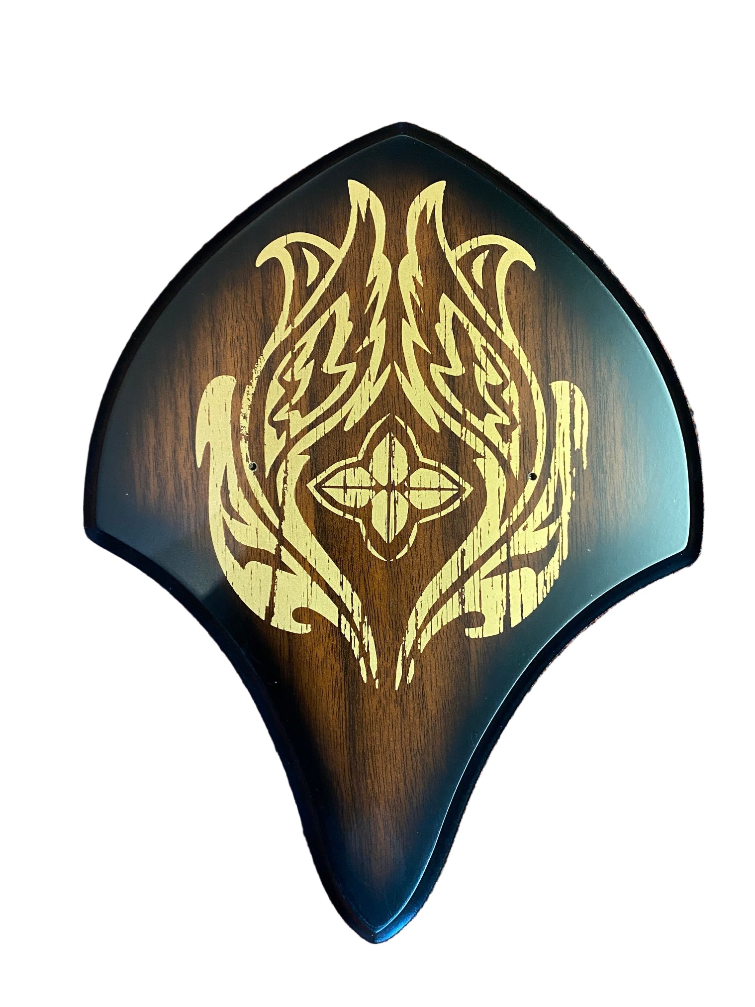 Wooden object with gold tribal design