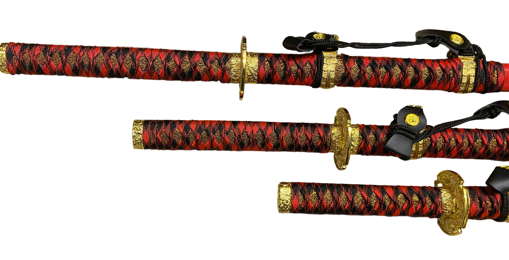 Three red and black patterned swords with gold accents on a white background