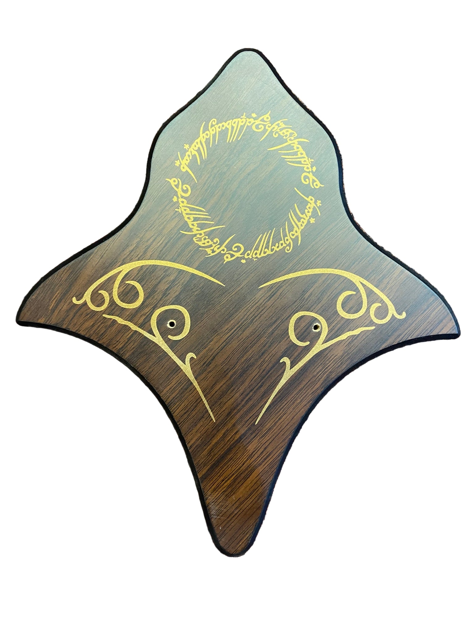 Wooden plaque with engraved text on a textured surface