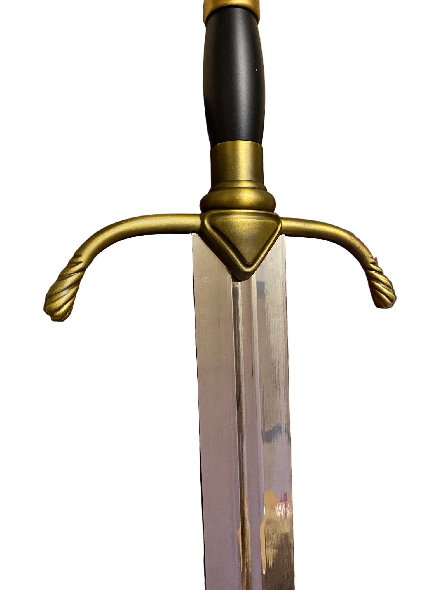 Decorative sword with gold and black handle on a black surface with red dragon design