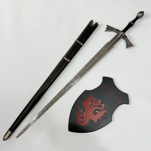 Decorative sword with sheath and shield featuring a dragon design on a white background
