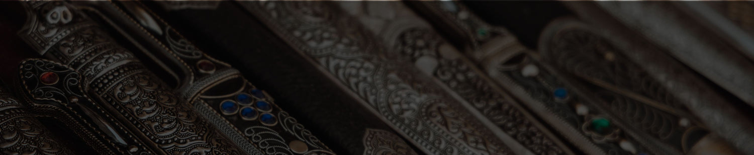 Ornamental Daggers - Row of arranged daggers on a dark background