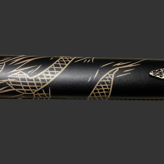Black sword with gold patterns on a dark background