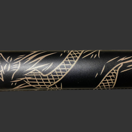 Black sword with gold tribal design on a black background