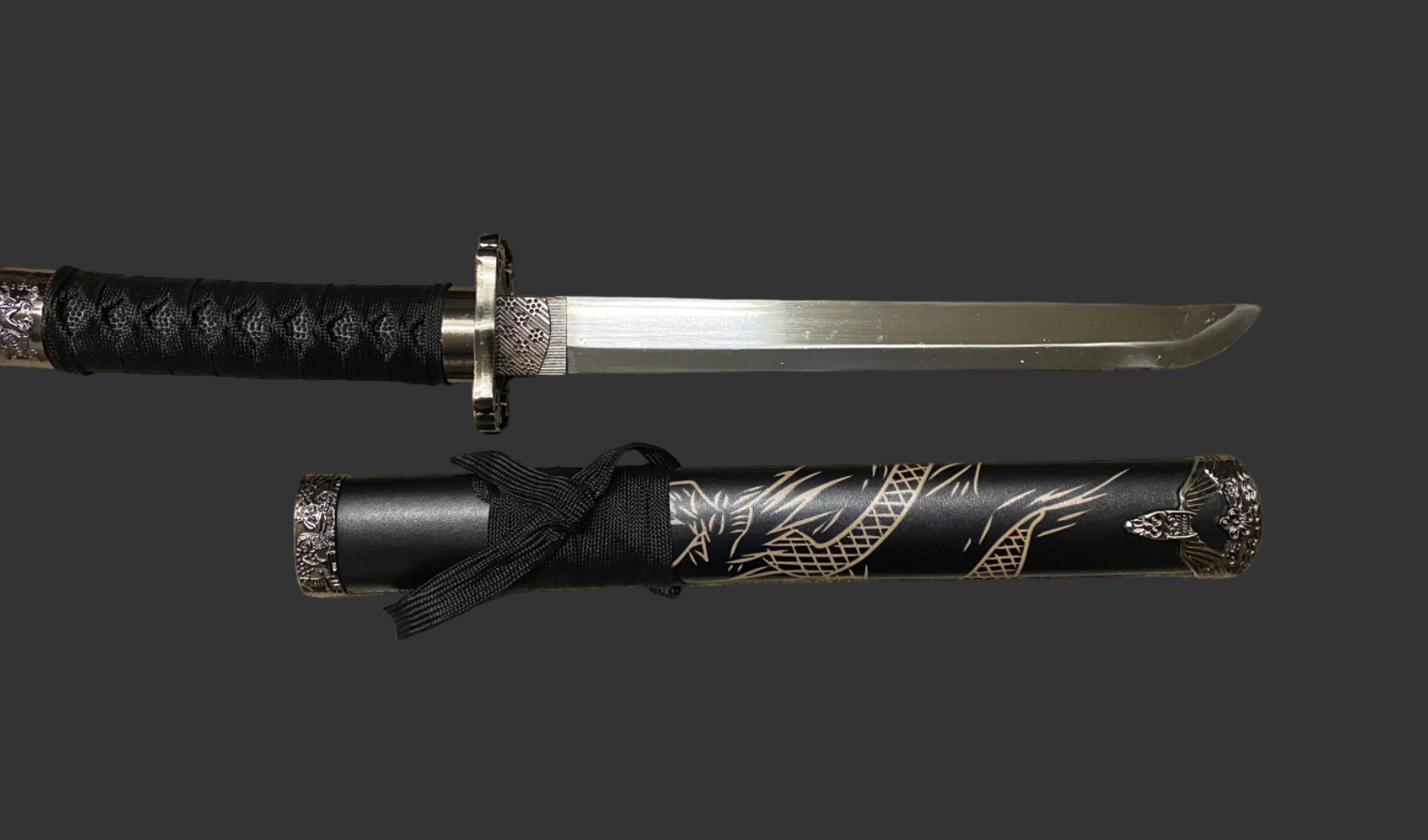 Sword with black sheath featuring gold designs on a dark background
