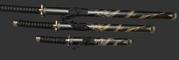 Three black and gold decorative swords on a dark background