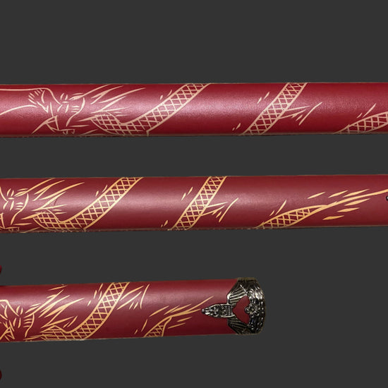 Three red swords with gold patterns on a dark background