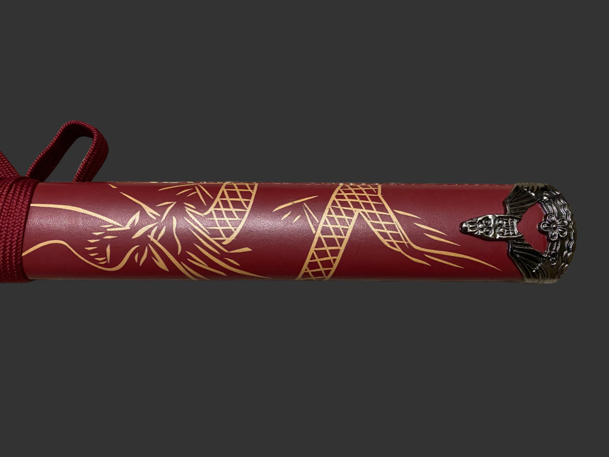 Red sword with gold patterns on a gray background