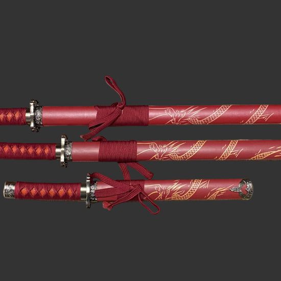 Set of red swords with decorative handles on a dark background