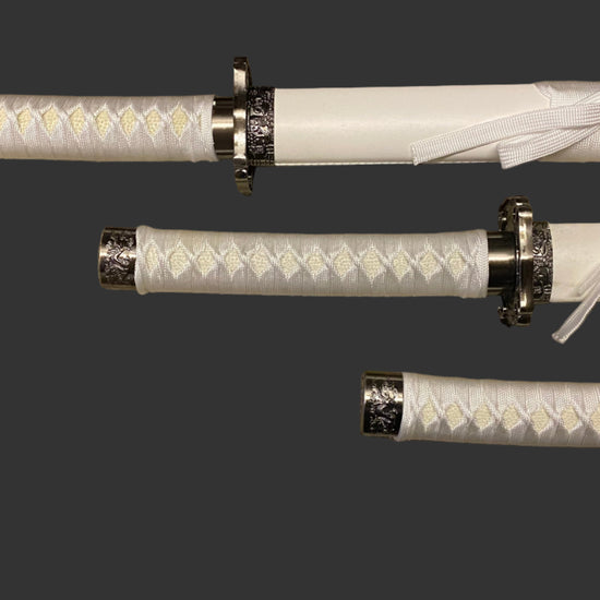 Three white swords with black accents on a dark background