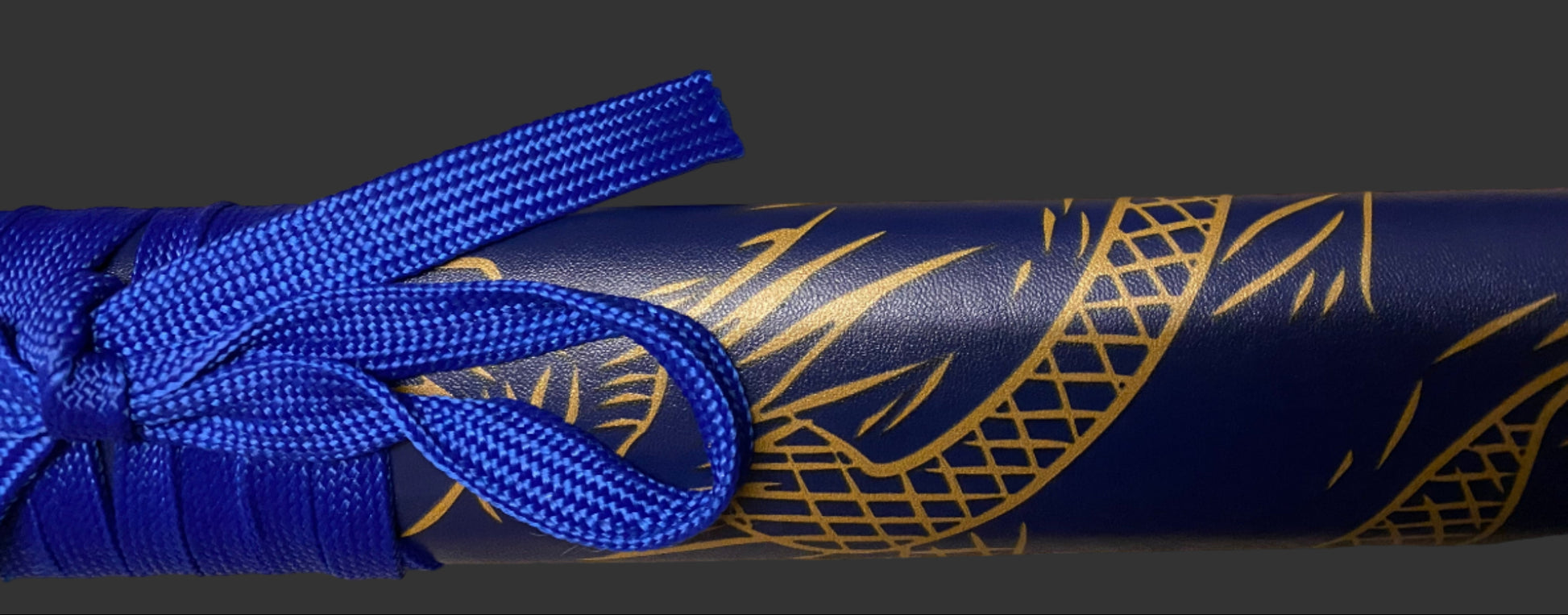 Blue sword with gold patterns on a dark background