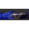 Blue sword with gold patterns on a dark background