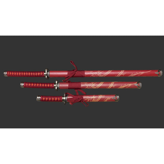 Set of red swords with decorative handles on a dark background