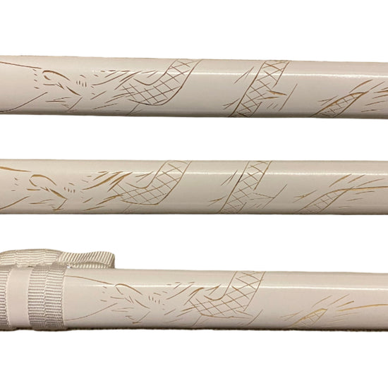 Close-up of a white rifle stock with engraved designs on a white background