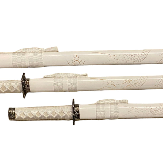 Set of three white swords with black hilts on a white background