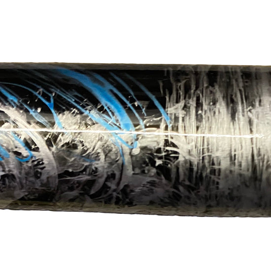 Close-up of a cylindrical object with abstract patterns on a white background