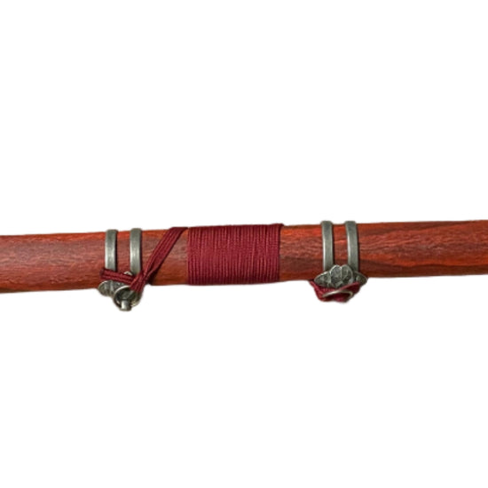 Red sword with a black blade on a white background