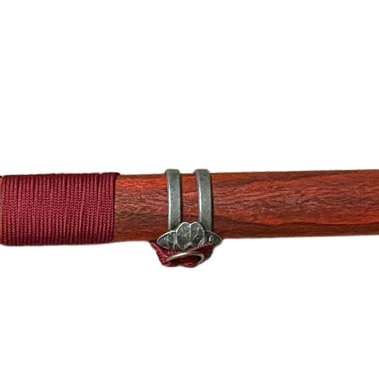 Sword with a red sheath on a white background