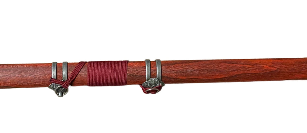 Sword with a red sheath on a white background