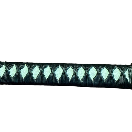 Decorative sword handle with a patterned grip on a white background