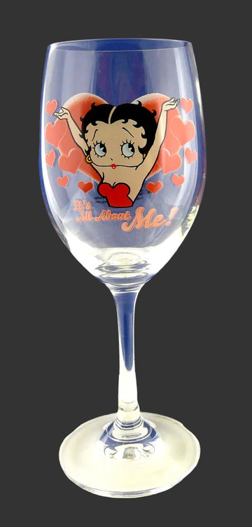 A clear wine glass featuring a Betty Boop illustration with red hearts and the text 'Be Mine' on a blue gradient background.