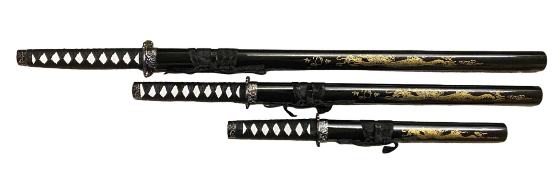 Set of three black and gold samurai swords with sheaths on a white background