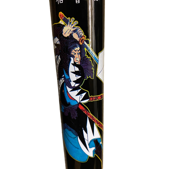 Black cylindrical object with a colorful samurai illustration on a white background