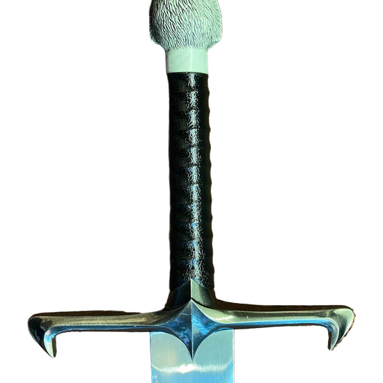 Decorative sword with a bear head handle on a white background