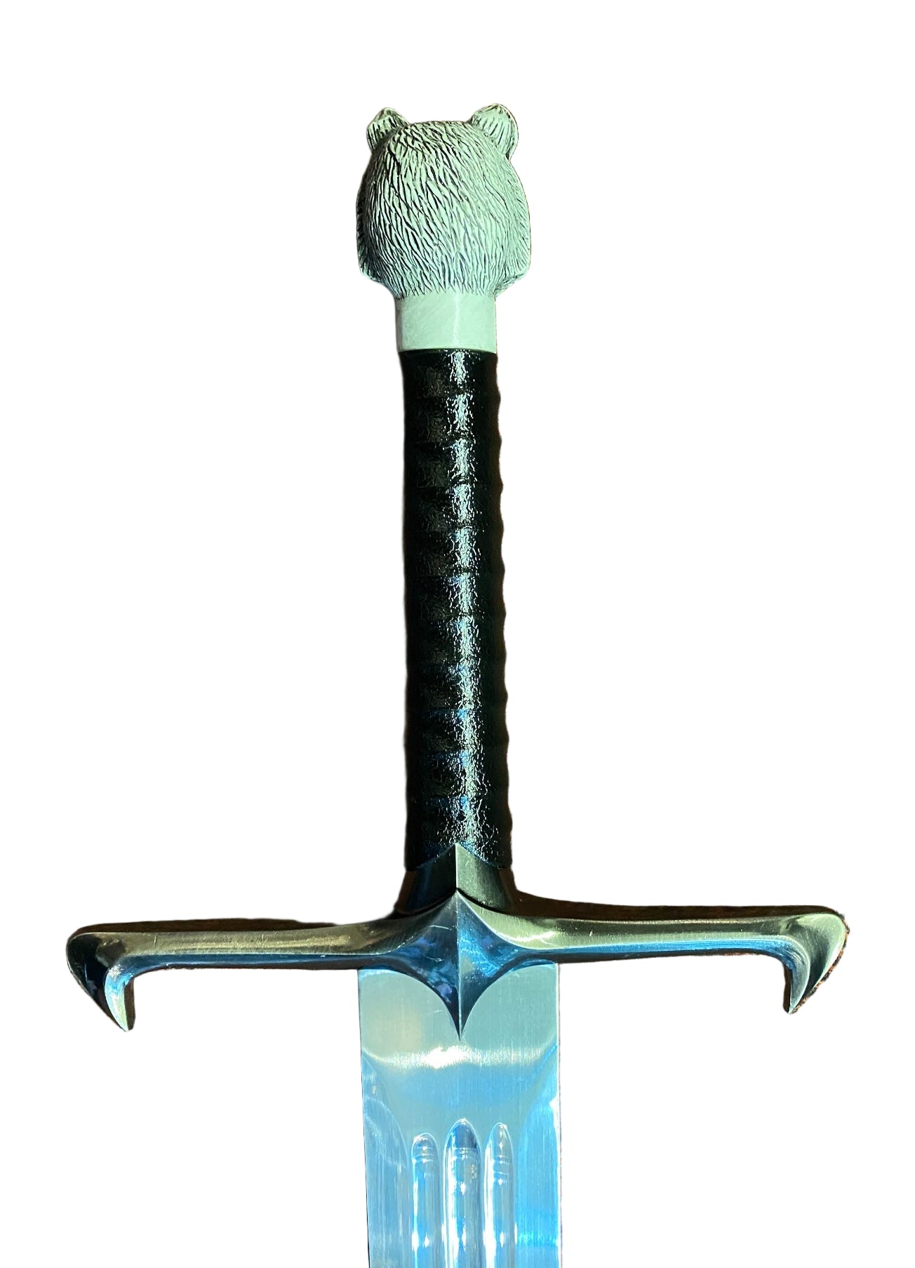 Decorative sword with a bear head handle on a white background