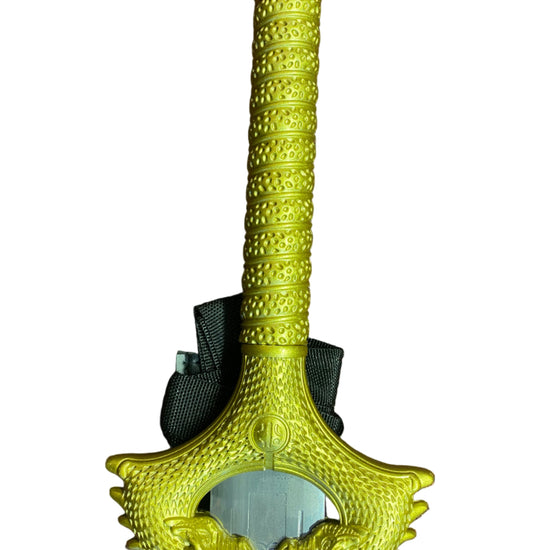 Decorative sword with a bright yellow handle on a white background