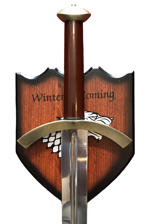 Sword with wooden sheath featuring 'Winter is Coming' text and a white wolf emblem on a red background.