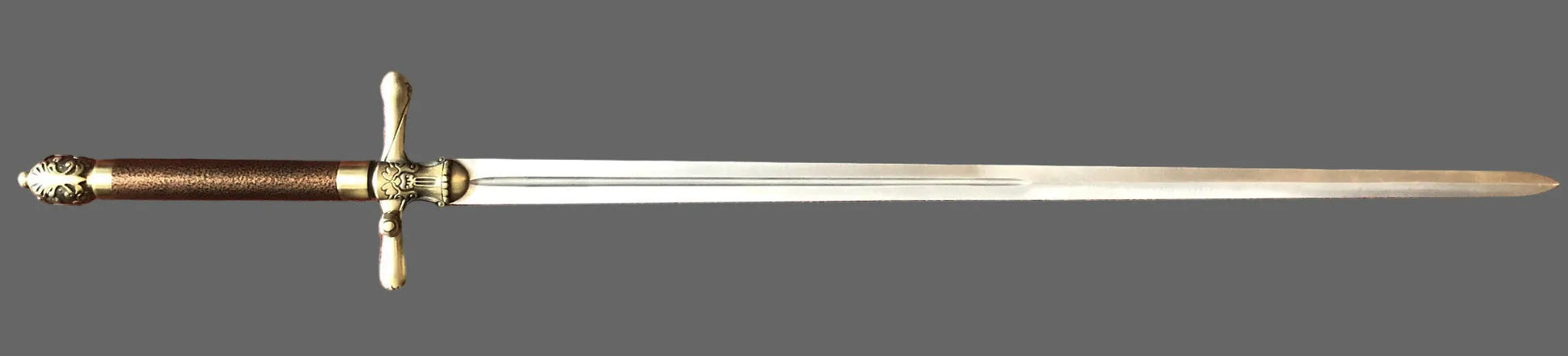 Decorative sword with a gold hilt on a dark gray background