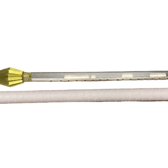 sword handle with gold accents on a white surface