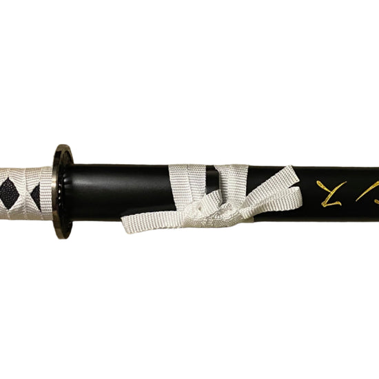 Sword with a black and white handle on a white background