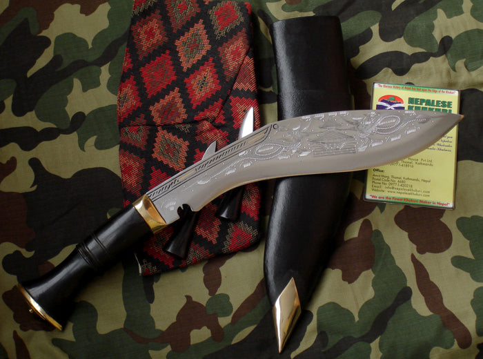 Decorative knife with black handle and silver blade on a camouflage background