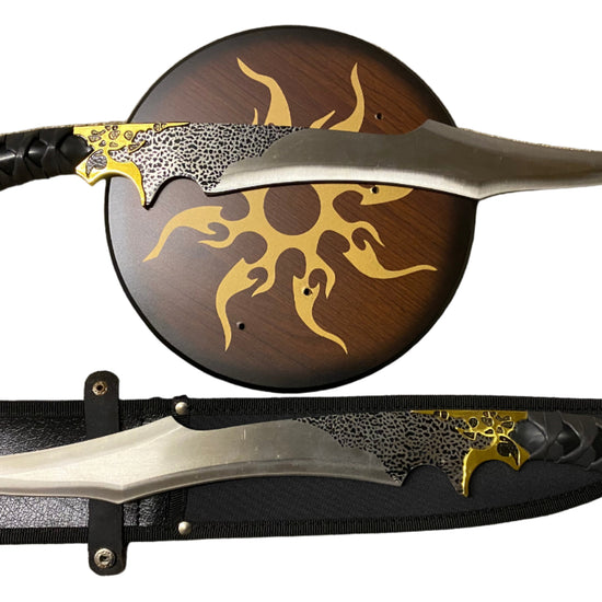 Decorative knife with a wooden sheath featuring artistic designs on a white background