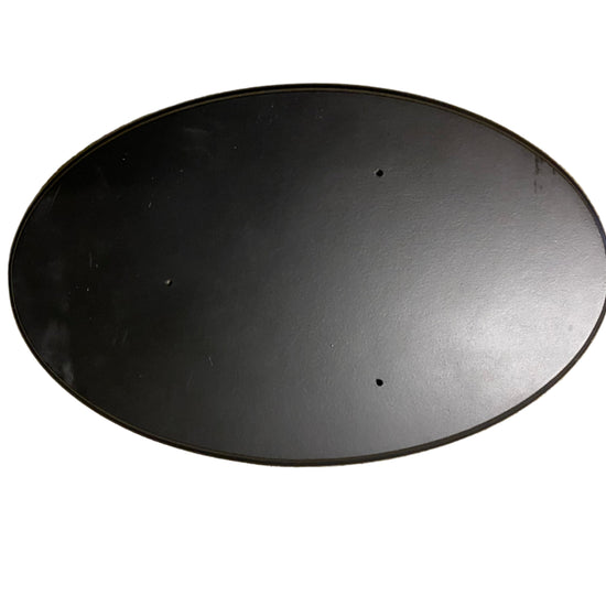 Round black metal object on a white background