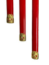 Three red objects with gold decorative elements on a white background