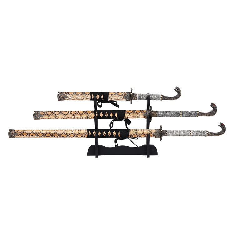 Set of three swords with decorative sheaths on a white background