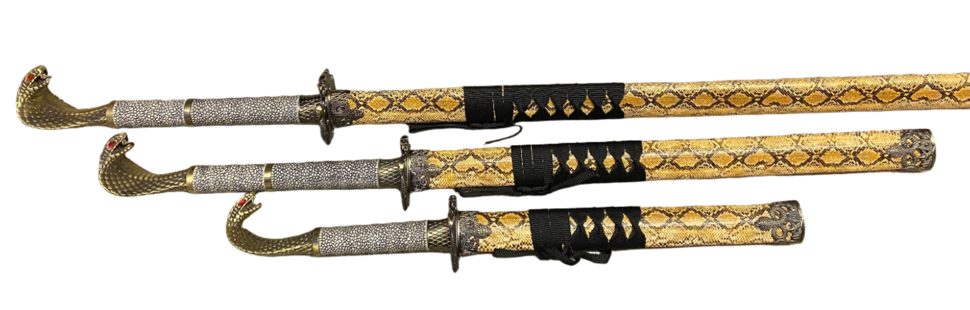 Three ornate swords with decorative sheaths on a white background