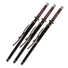 Three black and red samurai swords with decorative handles on a white background