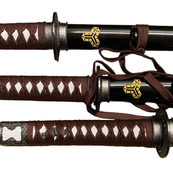 Three samurai swords with brown sheaths on a white background