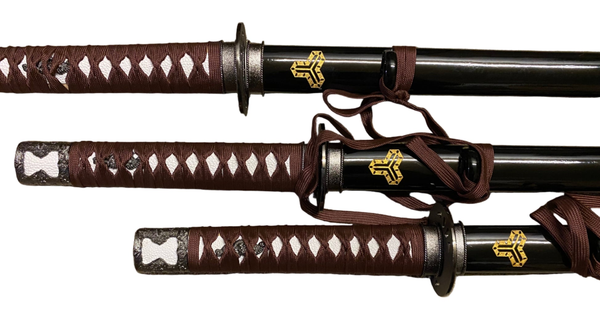 Three samurai swords with brown sheaths on a white background