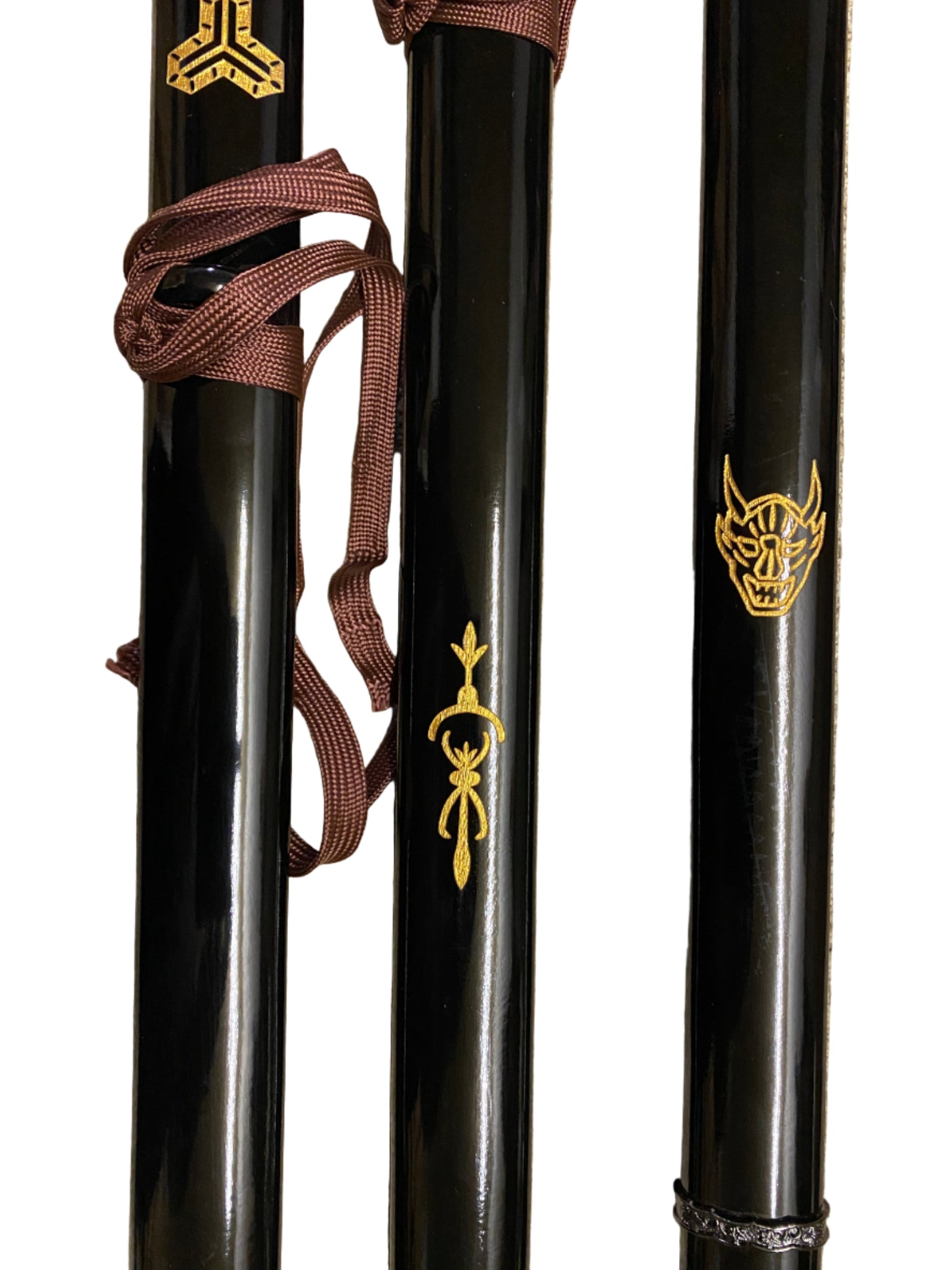 Three black swords with gold symbols on a white background